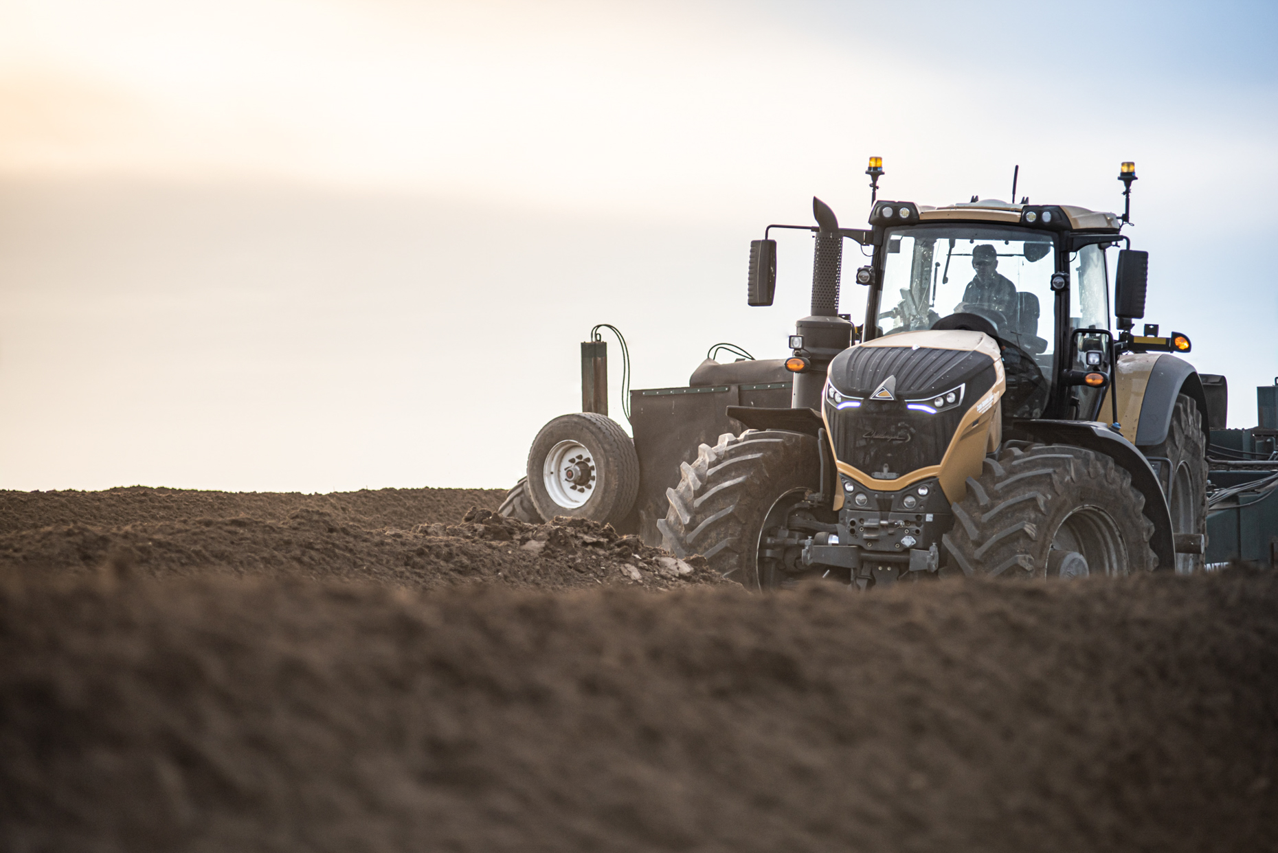Tractor in field turning compost rows. Isaac Miller Photography  | Agriculture & Industry Photographer  |  Commercial & Editorial photography  |   Missoula + San Antonio