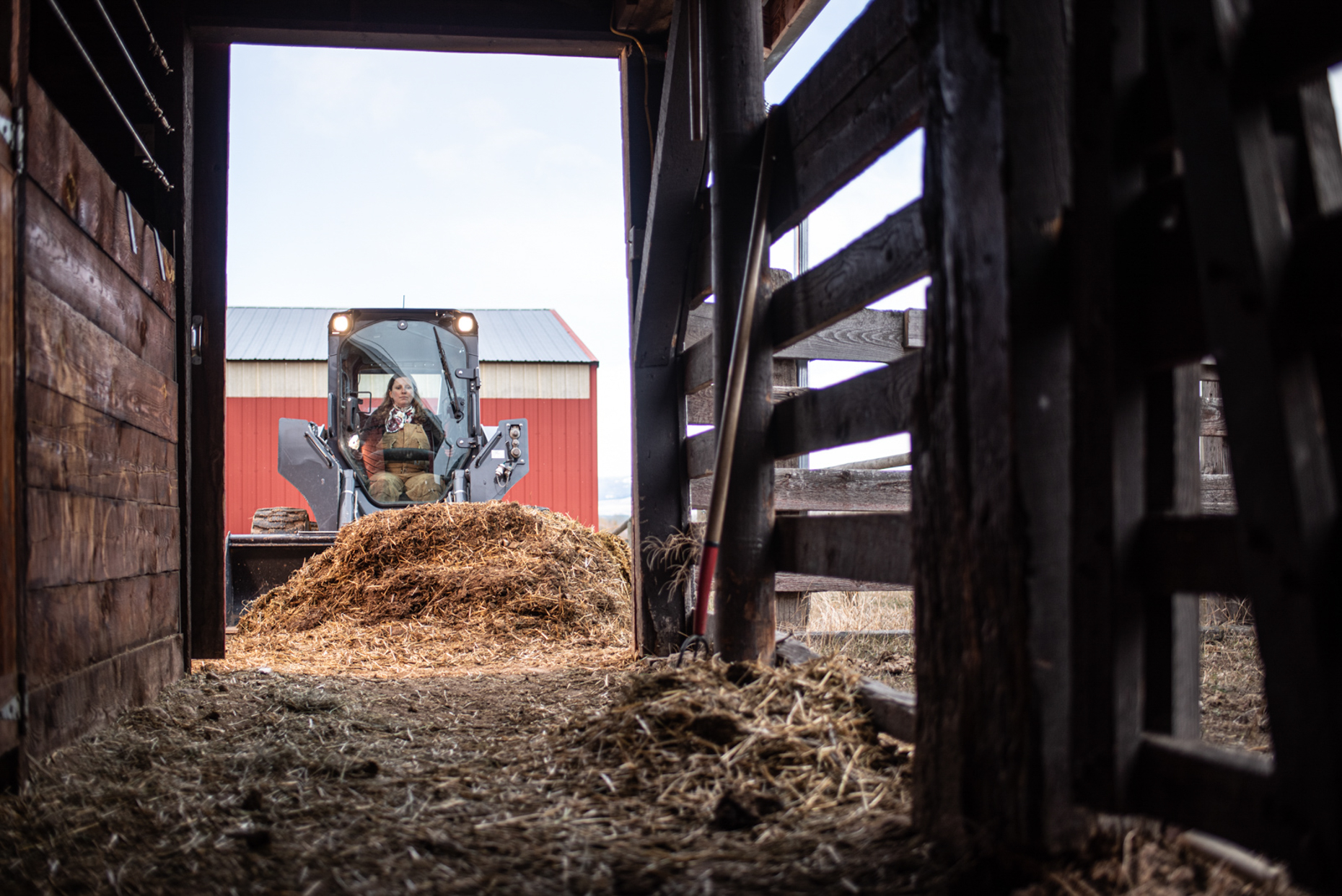 John Deere loader cleaning cattle pens. Isaac Miller Photography  | Agriculture & Industry Photographer  |  Commercial & Editorial photography  |   Missoula + San Antonio